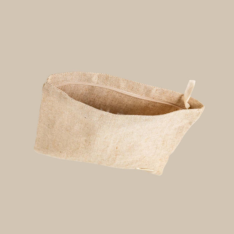 Eco-friendly beige travel tech pouch made from Juco, designed to organize electronics or serve as a stationery/pencil case.