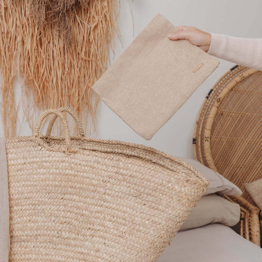 Eco-friendly beige travel tech pouch made from Juco, designed to organise electronics or serve as a stationery/pencil case.