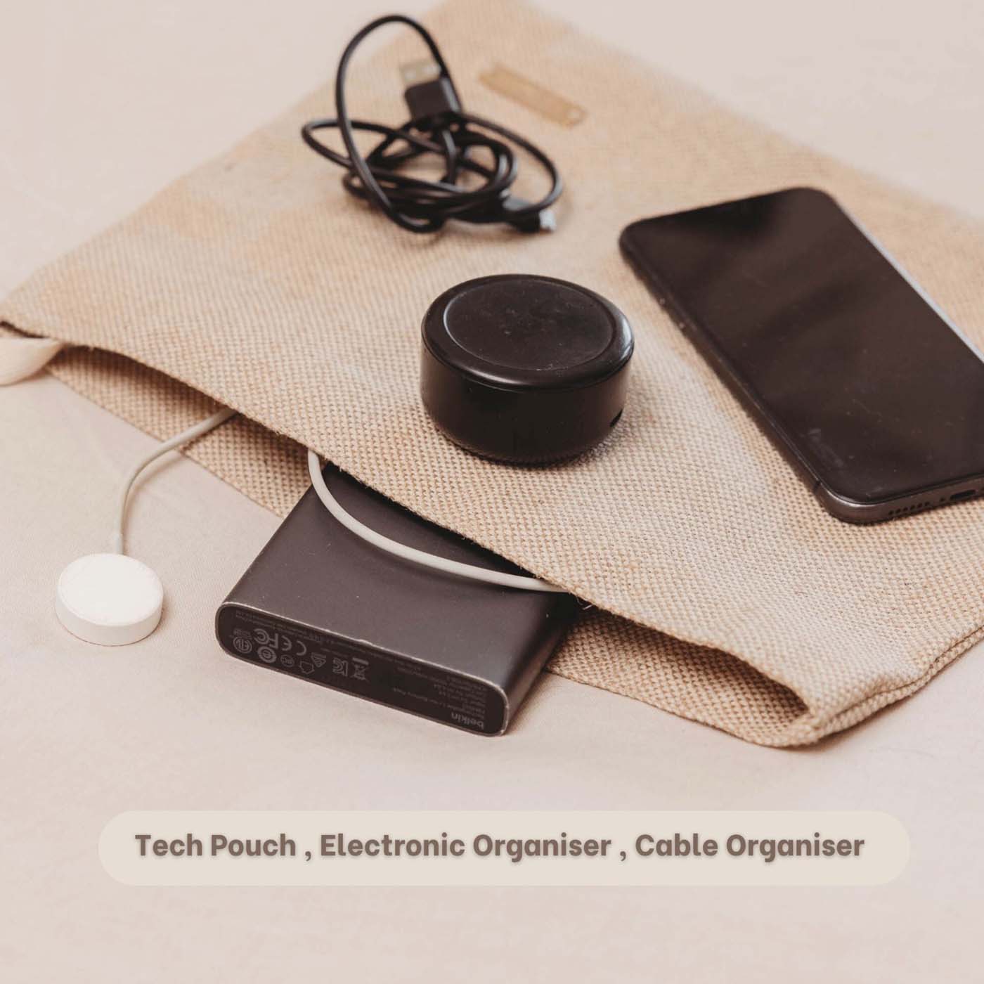 Gardgets inside Eco-friendly beige travel tech pouch made from Juco, designed to organize electronics or serve as a stationery/pencil case.