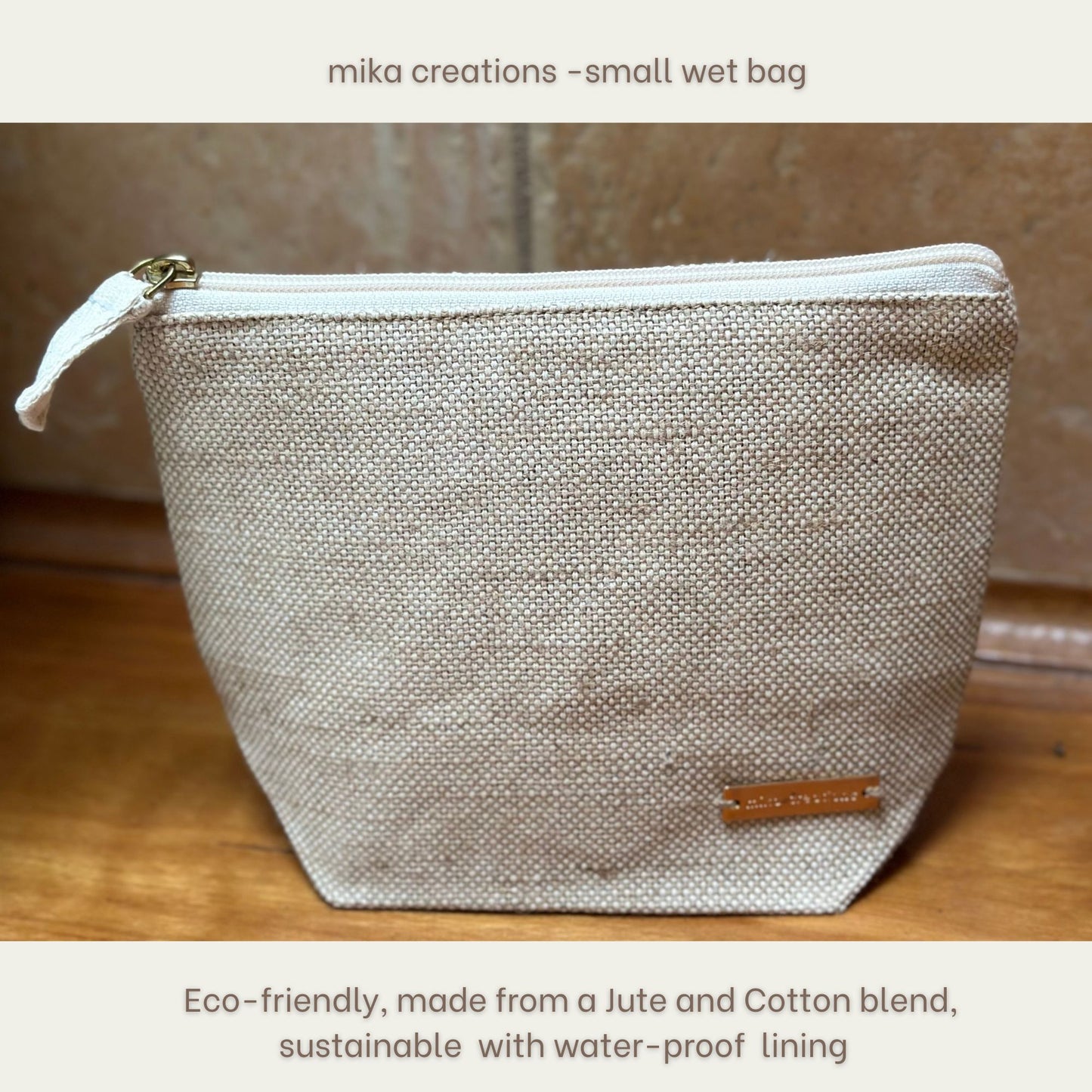 Small wet bag made from jute and cotton with a waterproof lining, branded 'mika creations'.
