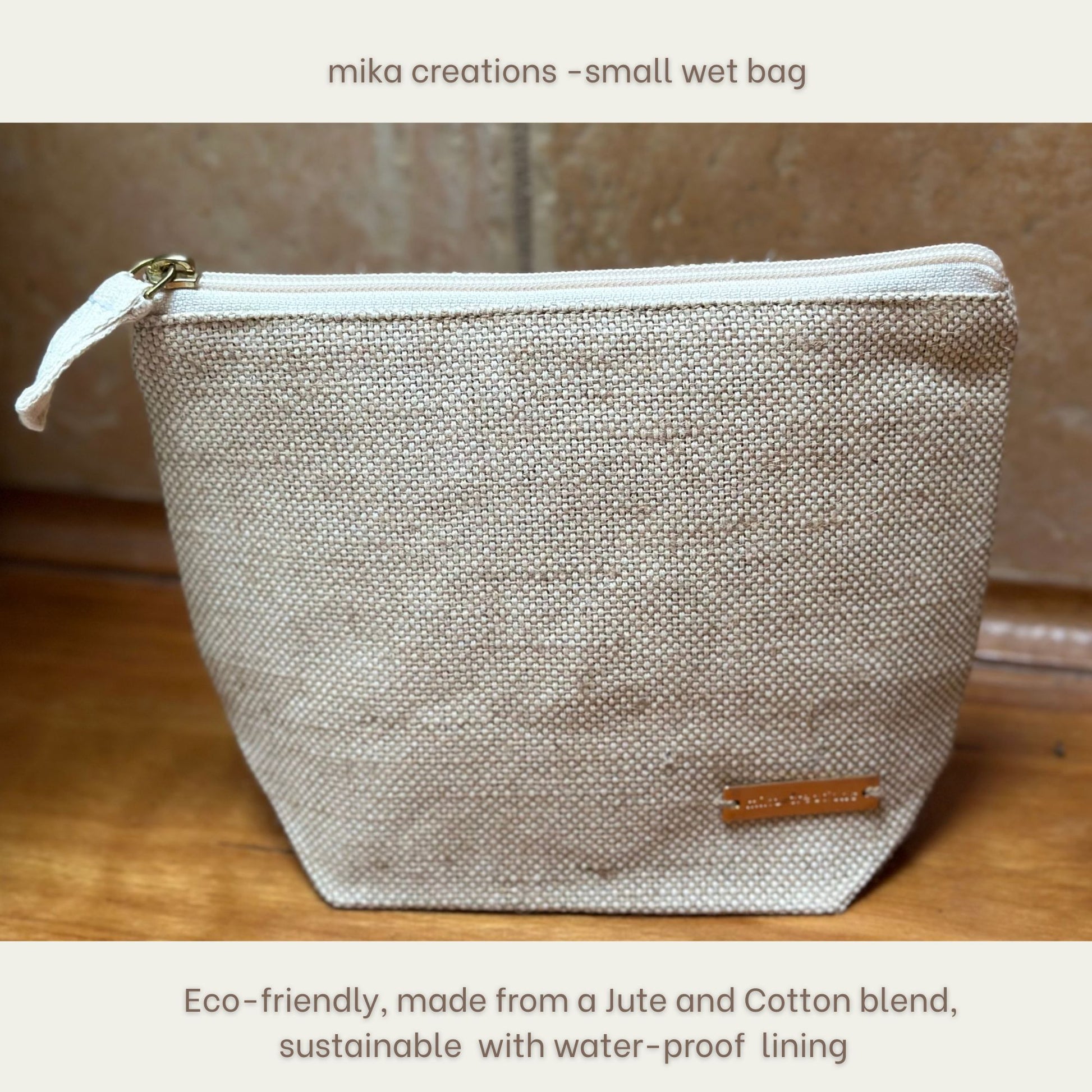 Small wet bag made from jute and cotton with a waterproof lining, branded 'mika creations'.