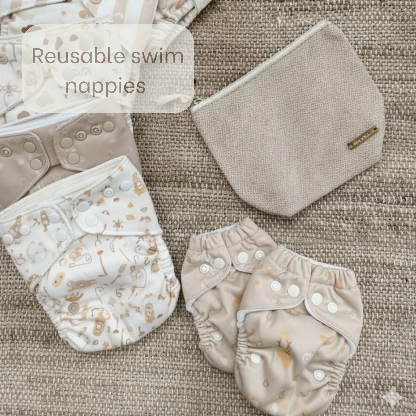 Small beige wet bag with reusable swim nappies around